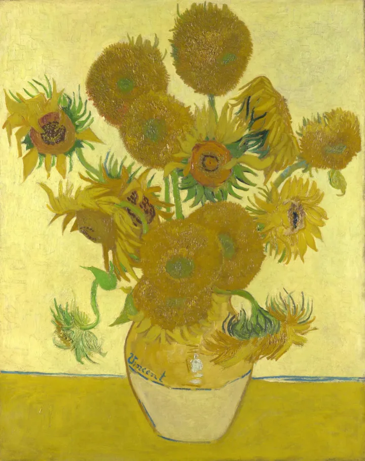 Sunflowers by Van Gogh, half under torn paper